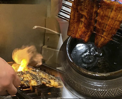 Broiling and seasoning Japanese Unagi